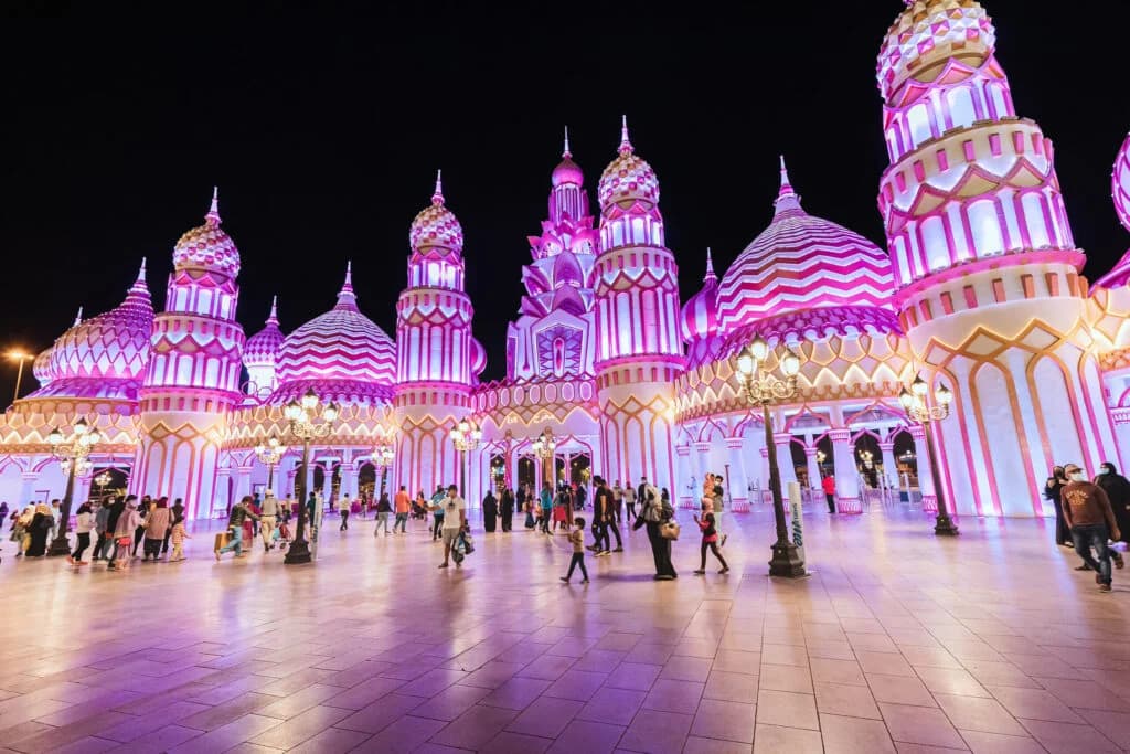 Global Village Season 31 pavilions lit up at night in Dubai